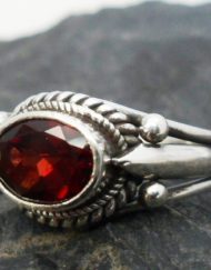 Details: ---Size-6 and 8 ---shank and band measures .15" wide flaring out to .33" wide at the top ---one large oval faceted Red Garnet Cabochon measures .33" long by .25" wide and is .25" deep ---.925 sterling silver ---quantity 2 Sterling Silver Designer Garnet Ring