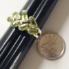 Sterling silver Peridot ring shown beside a Canadian dime to illustrate the size.